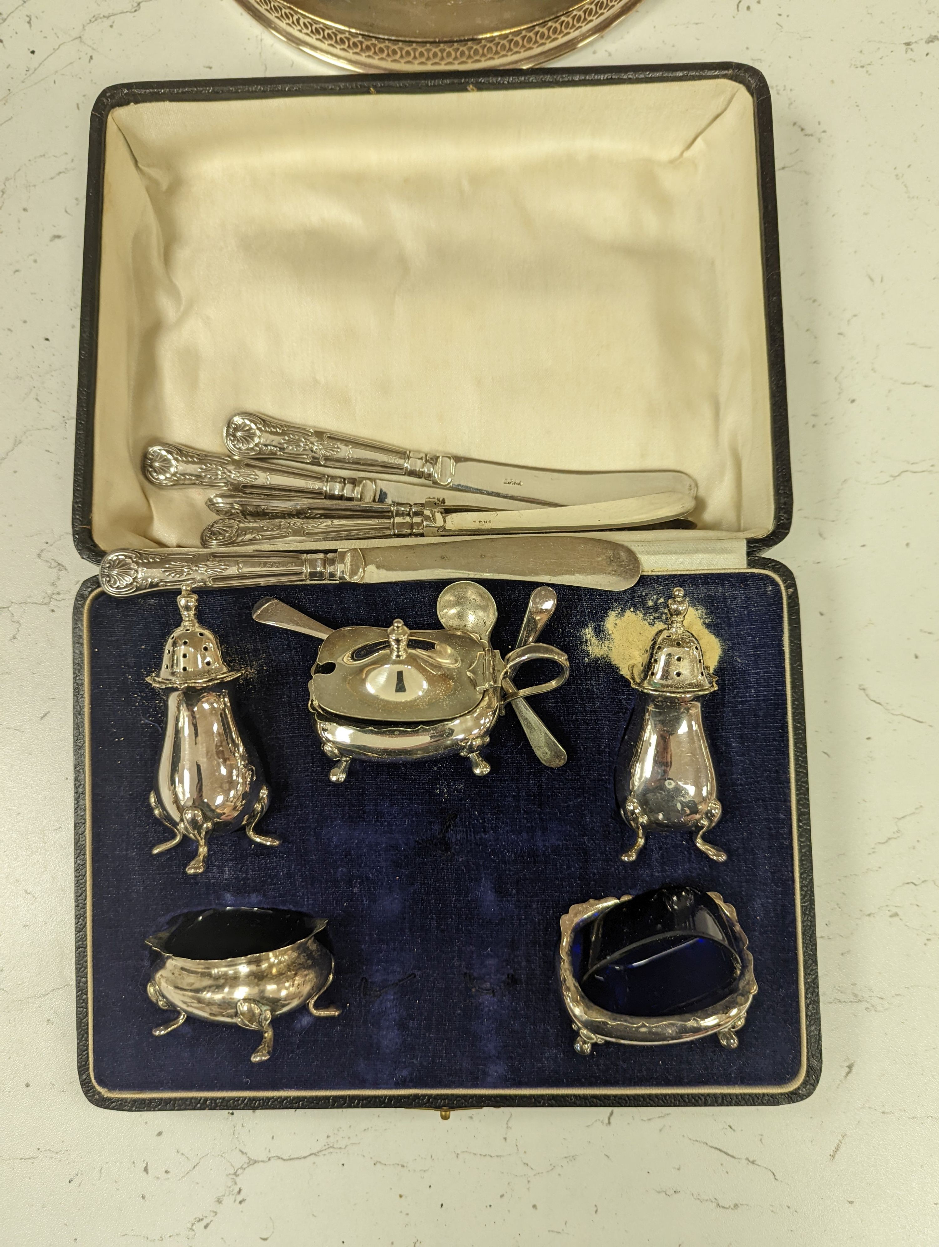 Six silver handled tea knives, two silver plated entree dishes, pair of candlesticks and other items